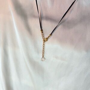 Black and gold with a clear quartz rose necklace
